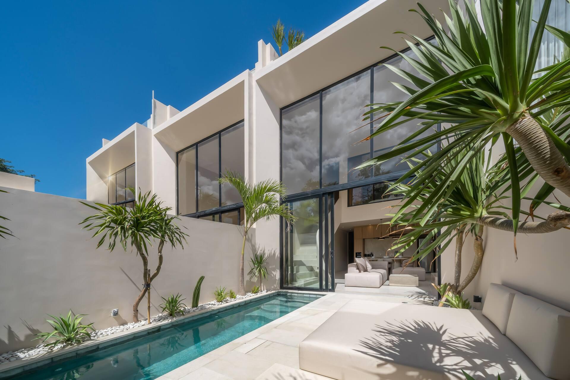 The lap pool at Enso 4 runs the length of a double-height glass facade in Bingin