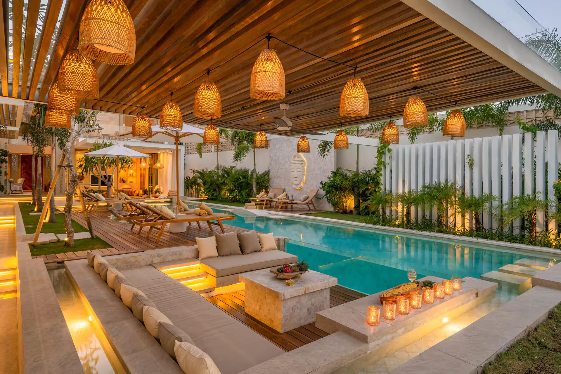 The 18-metre pool at Villa Vida with its sunken lounge, under a long row of woven pendants
