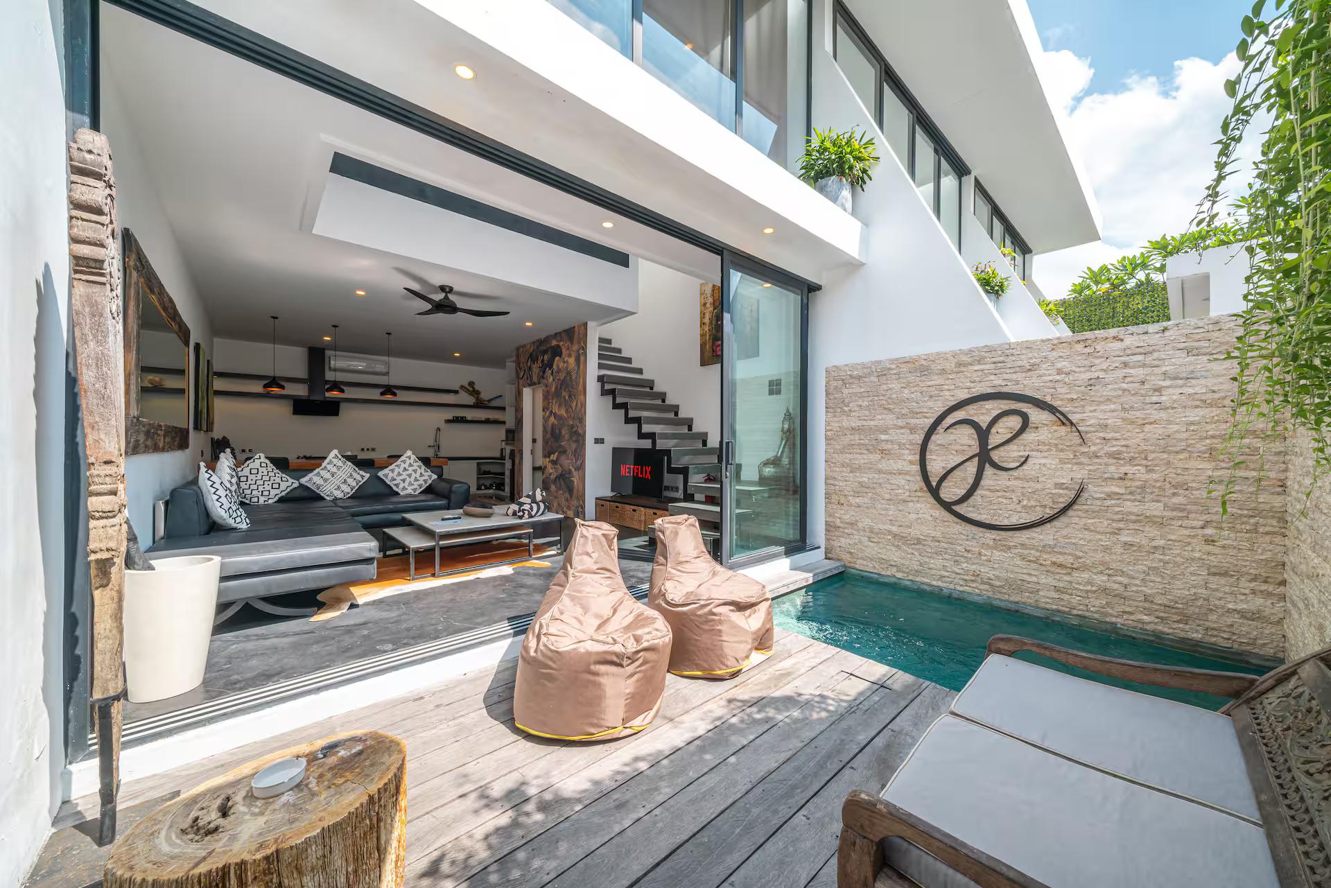 The plunge pool and timber deck at Loft Ludo 3, beanbags set along the water