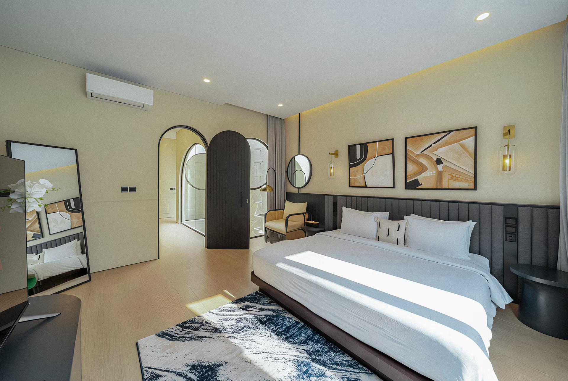 King bedroom with a fluted headboard wall and an arched recess set into the plaster