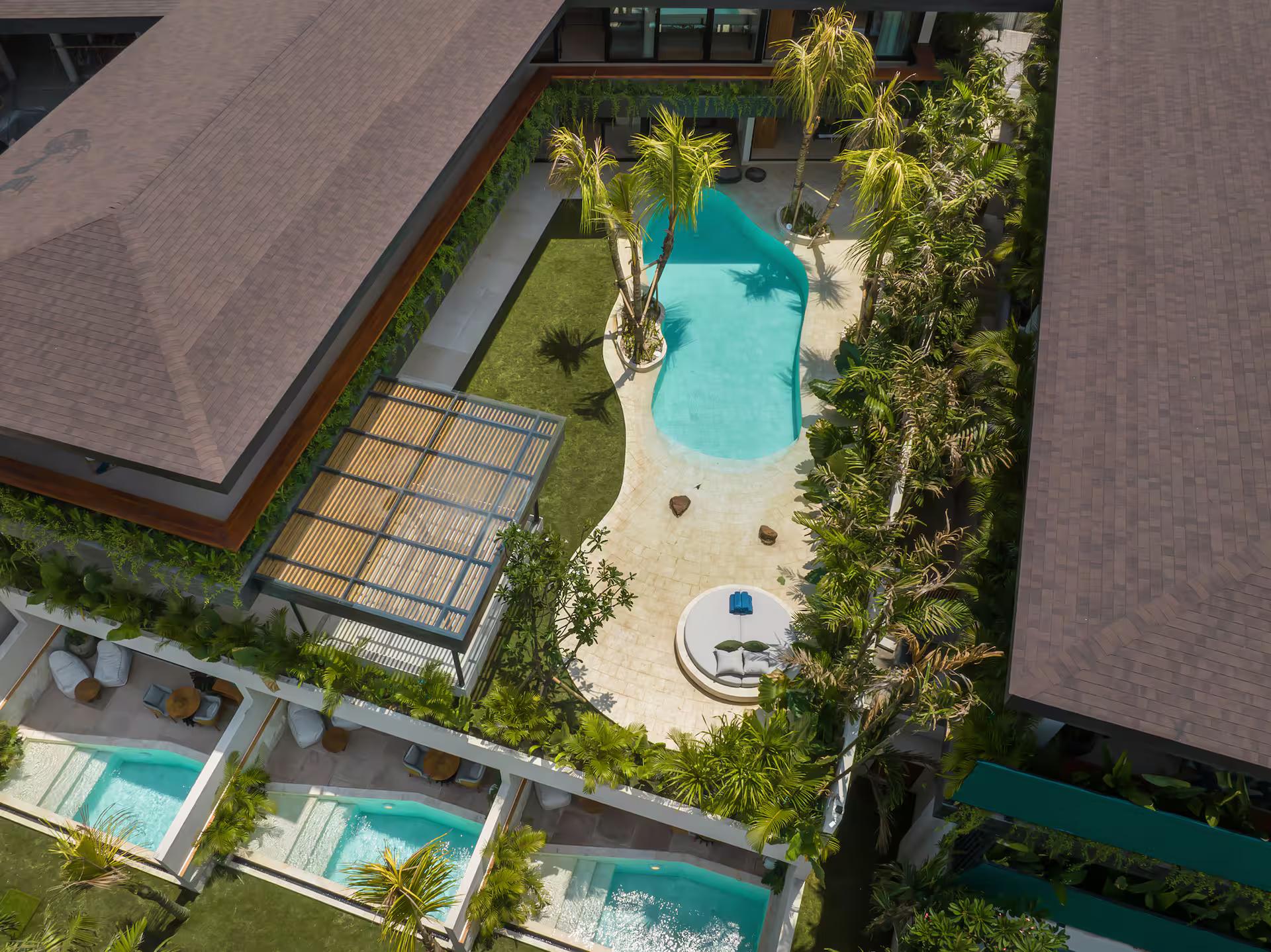 Villa Coco Bay from the air: the lagoon pool, the thatched roof and three loft plunge pools