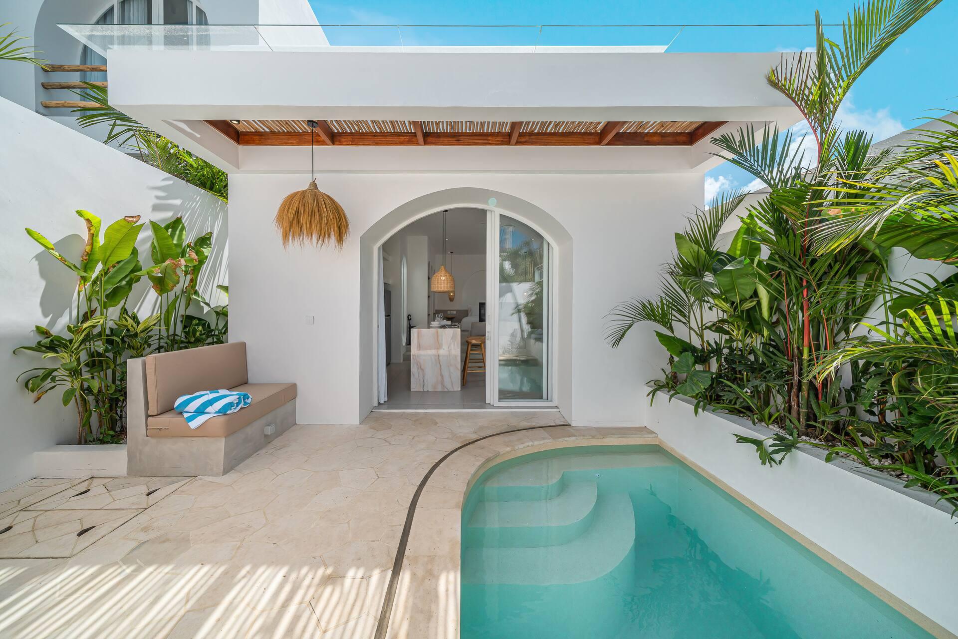 Looking across the pool to the arched opening into the living room at Las Casas 17