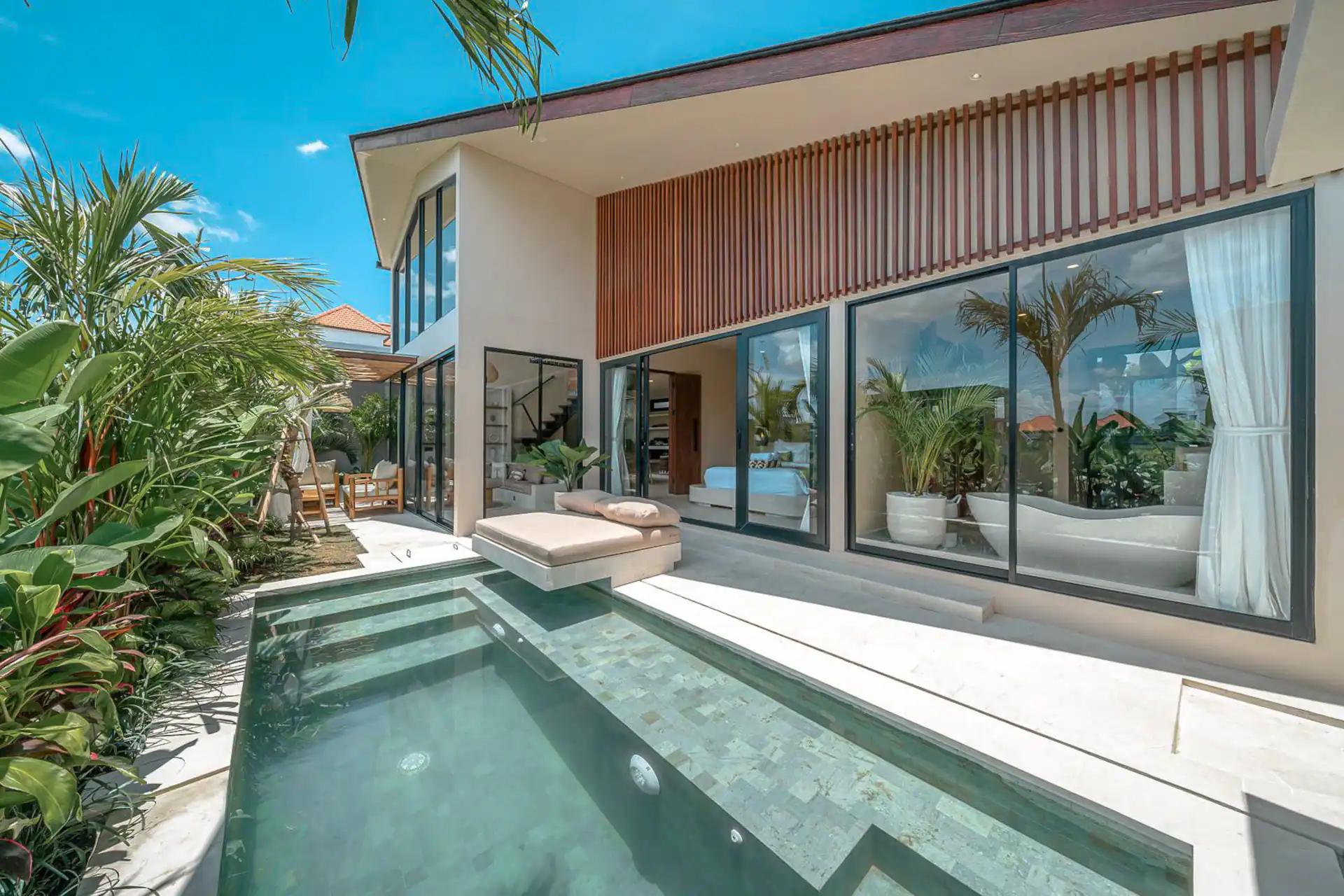 The lap pool running the length of Villa Ayo 1 beneath its louvred timber gable