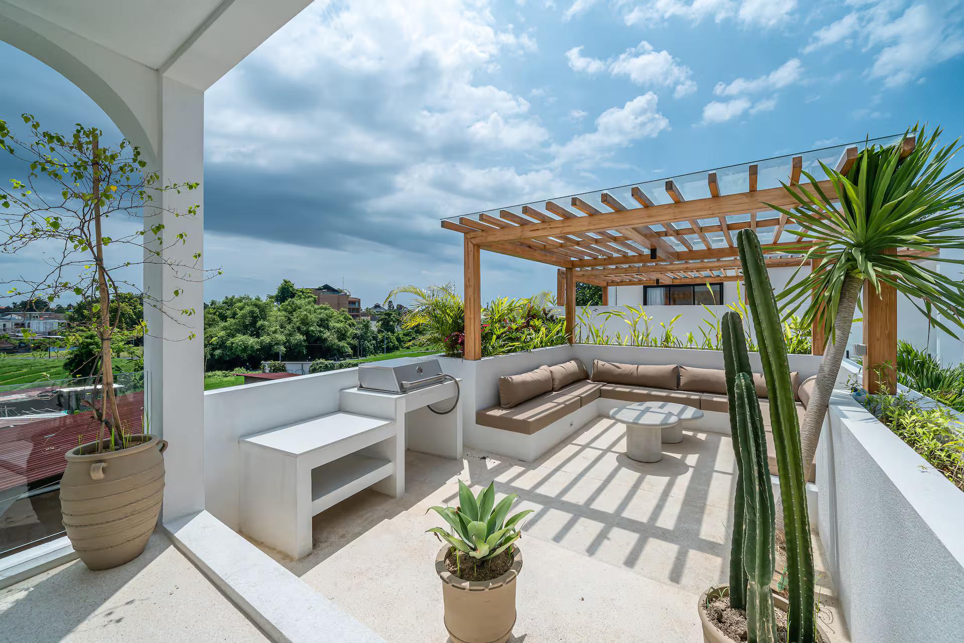 Slatted timber pergola over a built-in sectional on the roof terrace at Bellavista Amici