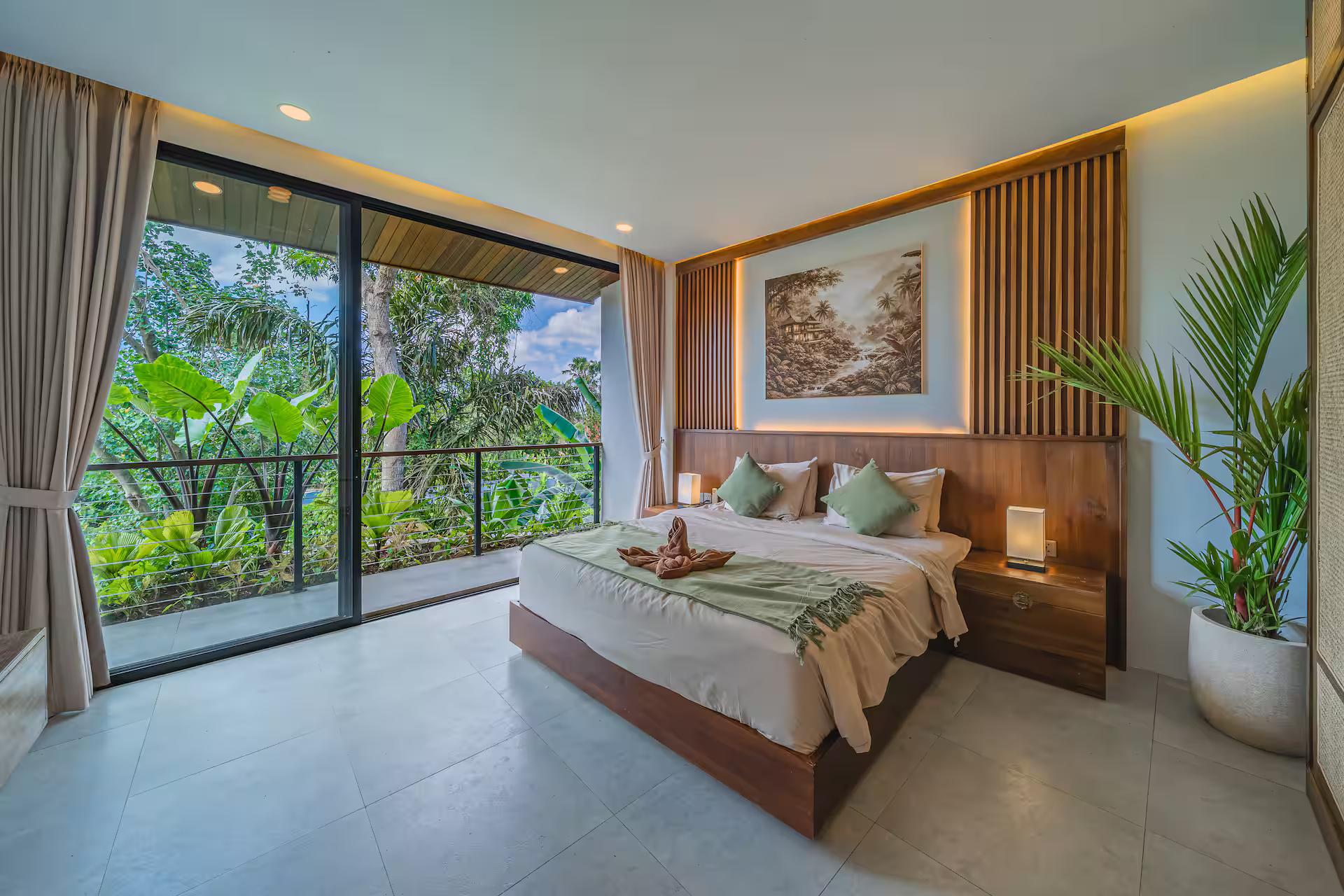 Bedroom with a timber-slat headboard wall and full-height glass onto the trees