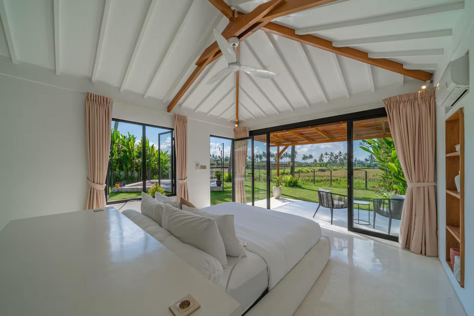 Queen bedroom at Villa Wellness Bisous with sliding glass onto the rice-field terrace