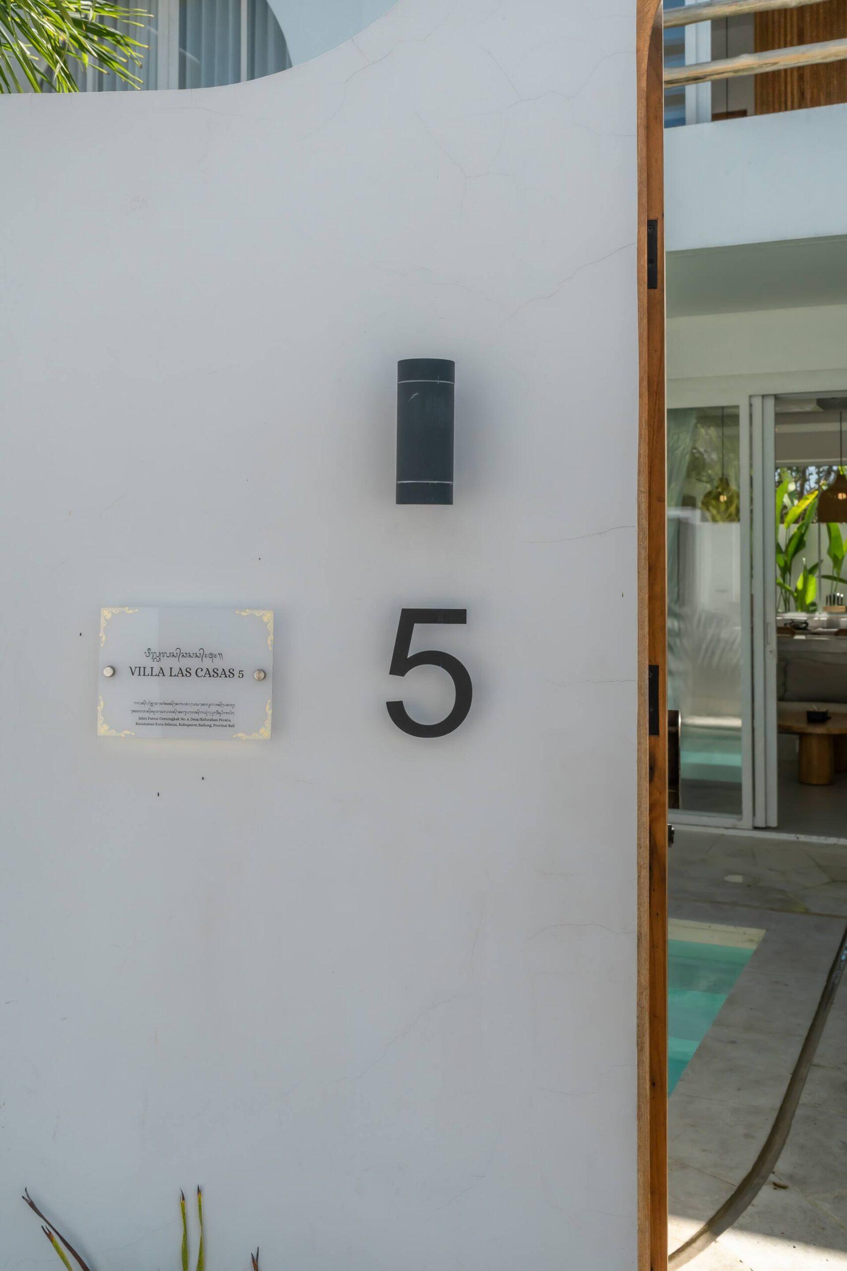 The villa's own doorway plaque marks this unit as number 5 within the Las Casas complex