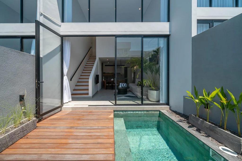 Teak deck and plunge pool at Sadila Estate 17, the staircase visible through the glass