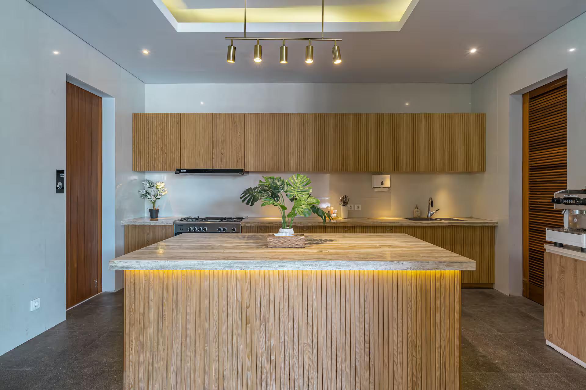 Designer kitchen with a fluted timber island and stone counter, coffee station behind